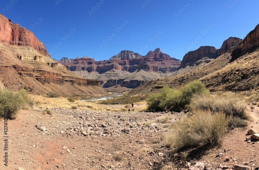 A stunning view of the Grand Canyon, with its deep red walls and crystal-clear river flowing through it under clear blue skies A stunning view of the Grand Canyon, with its deep red walls and crystal-clear river flowing through it under clear blue skies