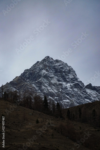 Majestic snow-capped mountain remote wilderness landscape photography serene environment aerial view nature's grandeur