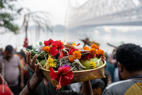 Devotee holding offerings during chhath puja celebration in kolkata