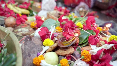 Traditional indian chhath puja offering with fruits and flowers
