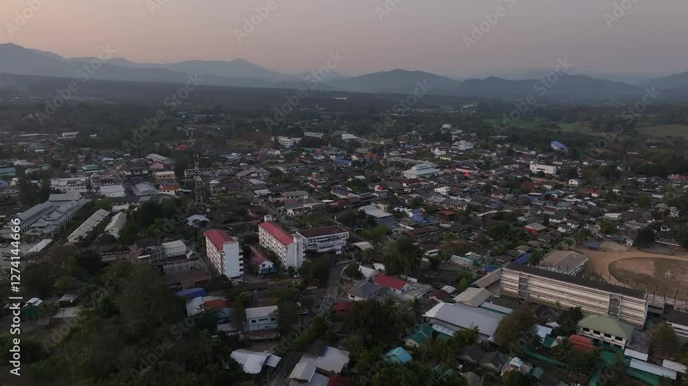 Sweeping aerial shot of Pai village at twilight. Aerial drone video Sweeping aerial shot of Pai village at twilight. Aerial drone video