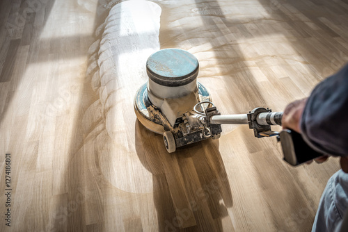 Professional sanding polishing machine cleans parquet floor
