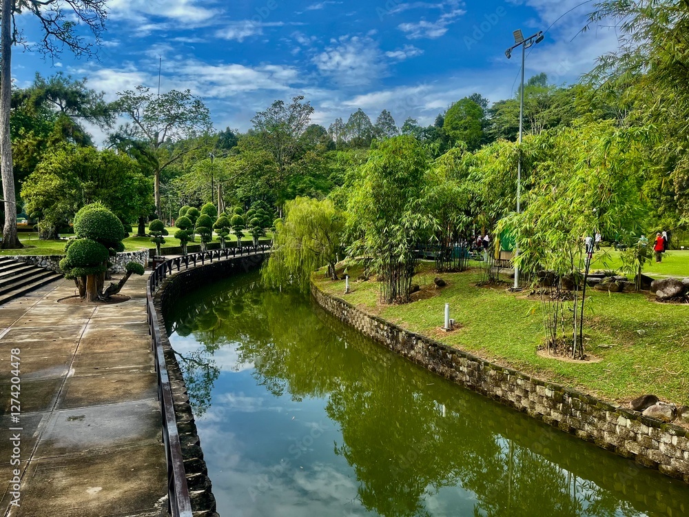 Fototapeta premium A tranquil river flowing through a picturesque lake, surrounded by lush greenery, scenic landscapes, and natural beauty.