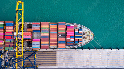 Canvas Print Cargo ships are unloading goods at a deep-sea port.