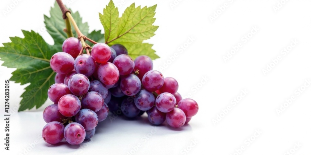 Fototapeta premium A Fresh Bunch of Vibrant Red Grapes with Lush Green Leaves Isolated on a White Background