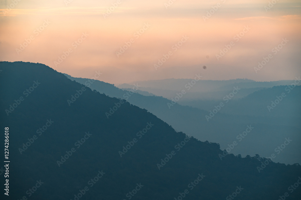 Experience Peaceful Beauty of Mountain Landscape: Scenic View of Sunset and Sunrise at the Peak, Silhouetted Against Vibrant Sky with Layers of Cloud Light, Breathtaking Horizon for Nature Travel Experience Peaceful Beauty of Mountain Landscape: Scenic View of Sunset and Sunrise at the Peak, Silhouetted Against Vibrant Sky with Layers of Cloud Light, Breathtaking Horizon for Nature Travel