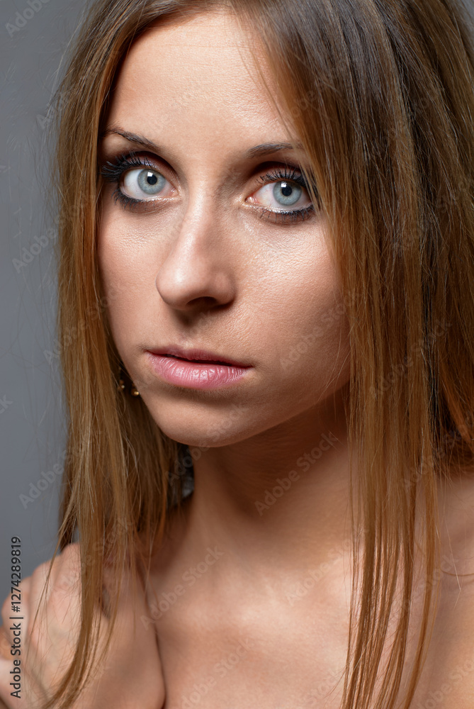 Portrait of a Young Woman With Natural Makeup and Intense Gaze.. Portrait of a Young Woman With Natural Makeup and Intense Gaze..