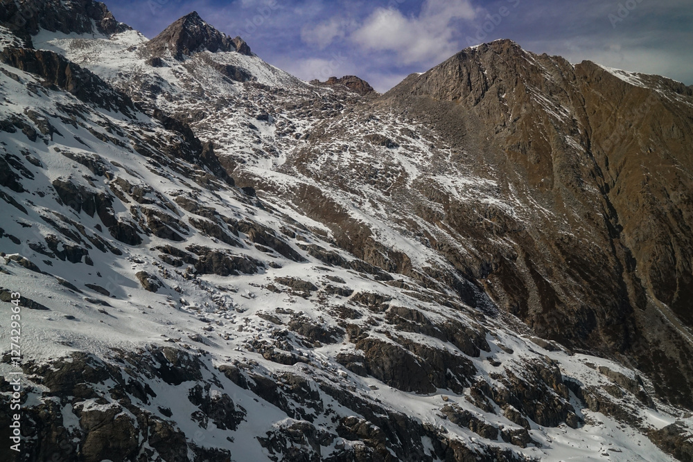 Obraz premium Stunning aerial view of snow-capped mountains alpine region landscape photography natural beauty majestic peaks