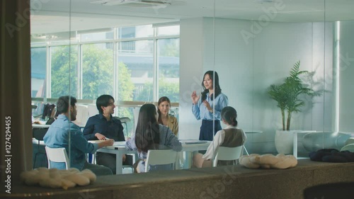 Confident Women leader discussing strategy meeting teamwork collaboration business growth analysis financial data presenting reports managing startup success corporate office people partnership