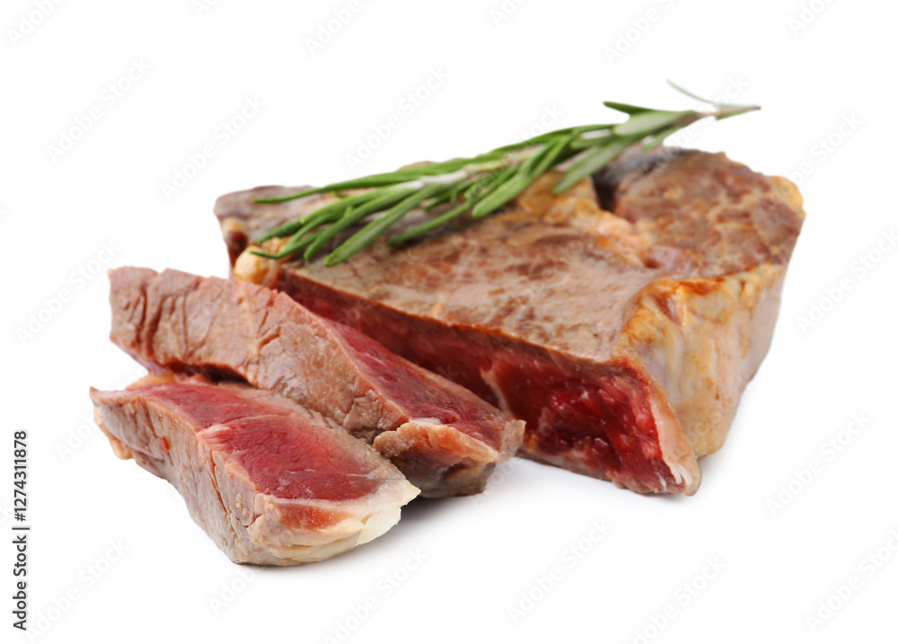Pieces of delicious beef meat and rosemary isolated on white Pieces of delicious beef meat and rosemary isolated on white