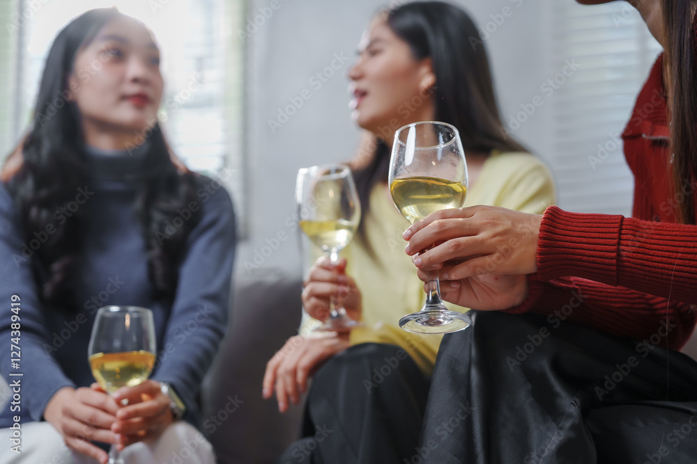 Women Enjoying a Relaxing Wine Gathering Indoors Women Enjoying a Relaxing Wine Gathering Indoors