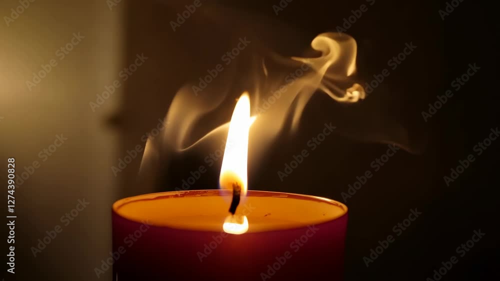 A close-up of a burning candle, with the flame flickering in the darkness A close-up of a burning candle, with the flame flickering in the darkness