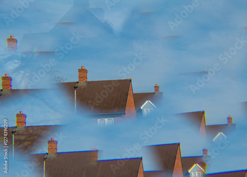 roof of a house against a blue sky through a prism