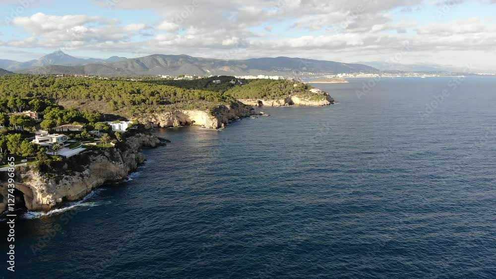 Cap Falco, located on the western coast of Mallorca, is a secluded and stunning cove known for its crystal-clear waters and rugged cliffs. Surrounded by untouched natural beauty and pine forests Cap Falco, located on the western coast of Mallorca, is a secluded and stunning cove known for its crystal-clear waters and rugged cliffs. Surrounded by untouched natural beauty and pine forests