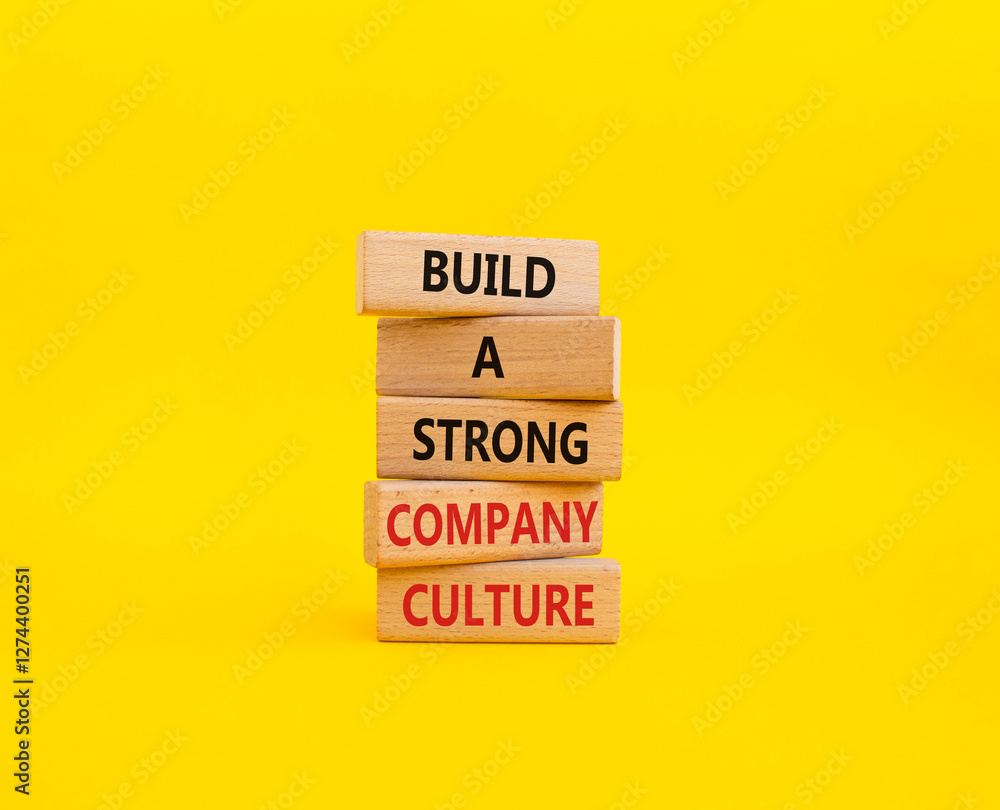 Company culture symbol. Wooden blocks with words Build a strong company culture. Beautiful yellow background. Business and Company culture concept. Copy space. Company culture symbol. Wooden blocks with words Build a strong company culture. Beautiful yellow background. Business and Company culture concept. Copy space.