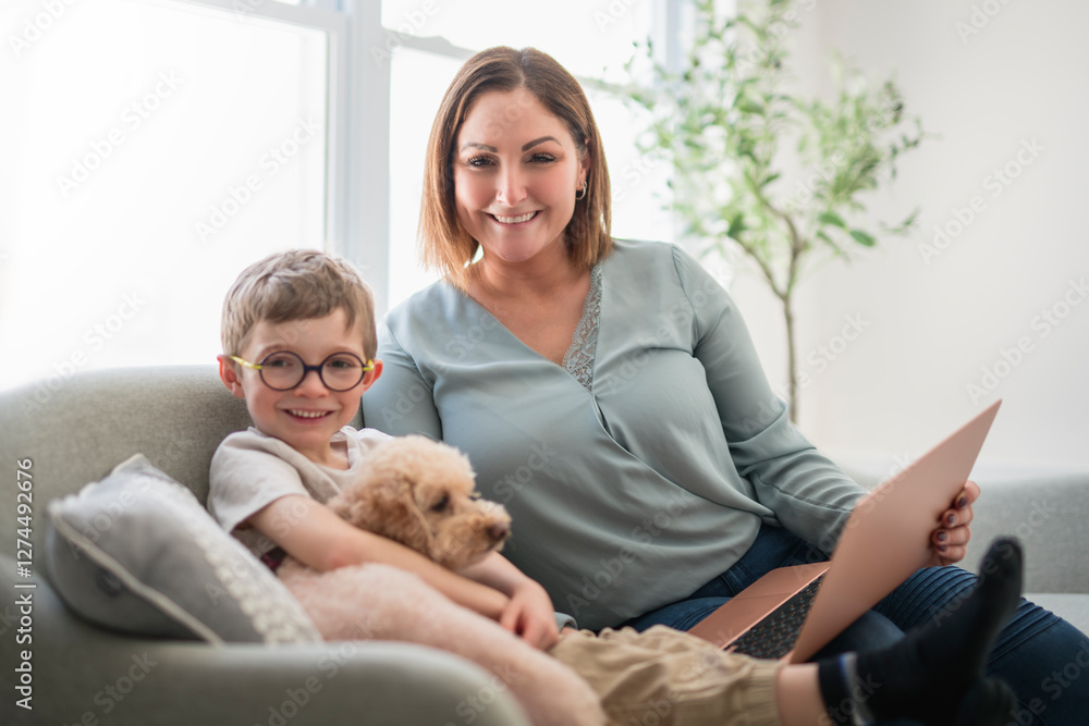 mother and her daughters and son portrait sit on sofa with dog at home mother and her daughters and son portrait sit on sofa with dog at home