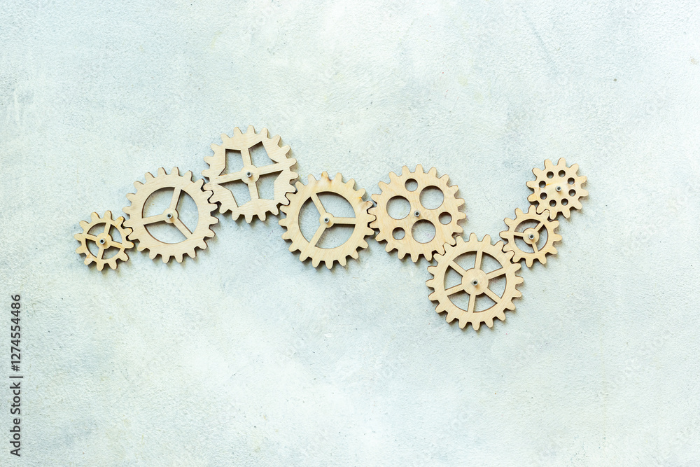 Top view of gears connected together as a symbol of teamwork and business automation Top view of gears connected together as a symbol of teamwork and business automation