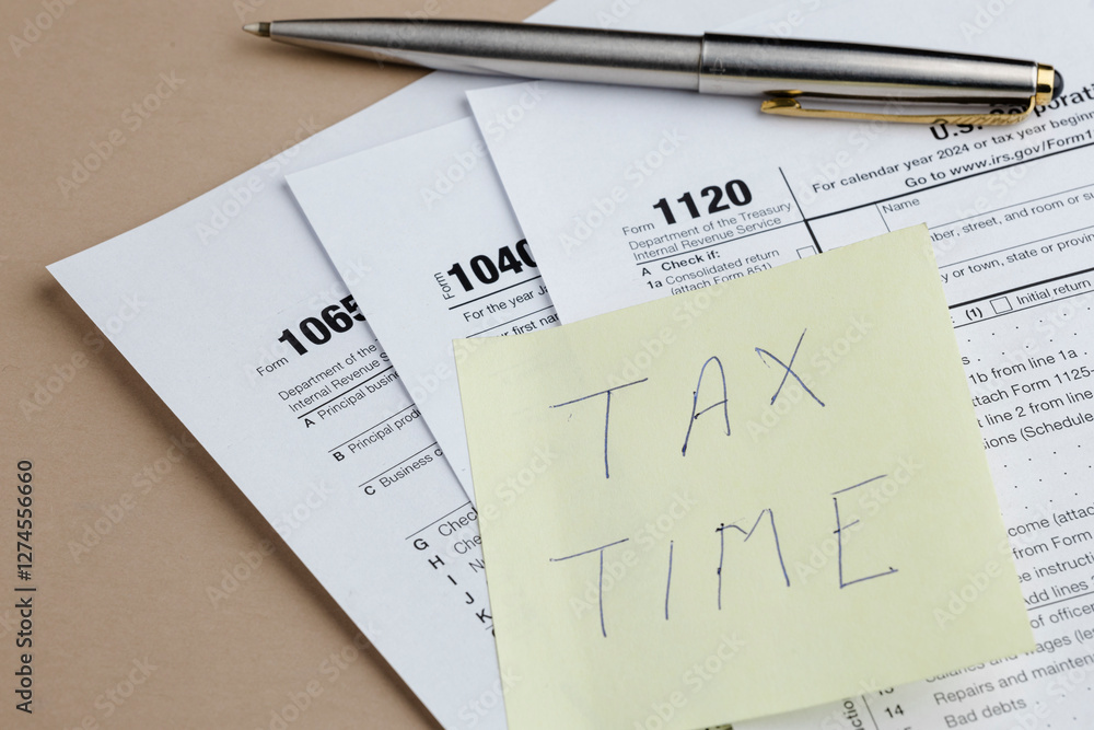 Tax forms and a pen. Time to do your taxes! Prepare your returns with this visual reminder. Accounting for the year is essential.