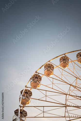 Ferris wheel cabins at sunrise