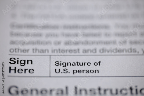 Close-up of a form indicating where to sign. It says 