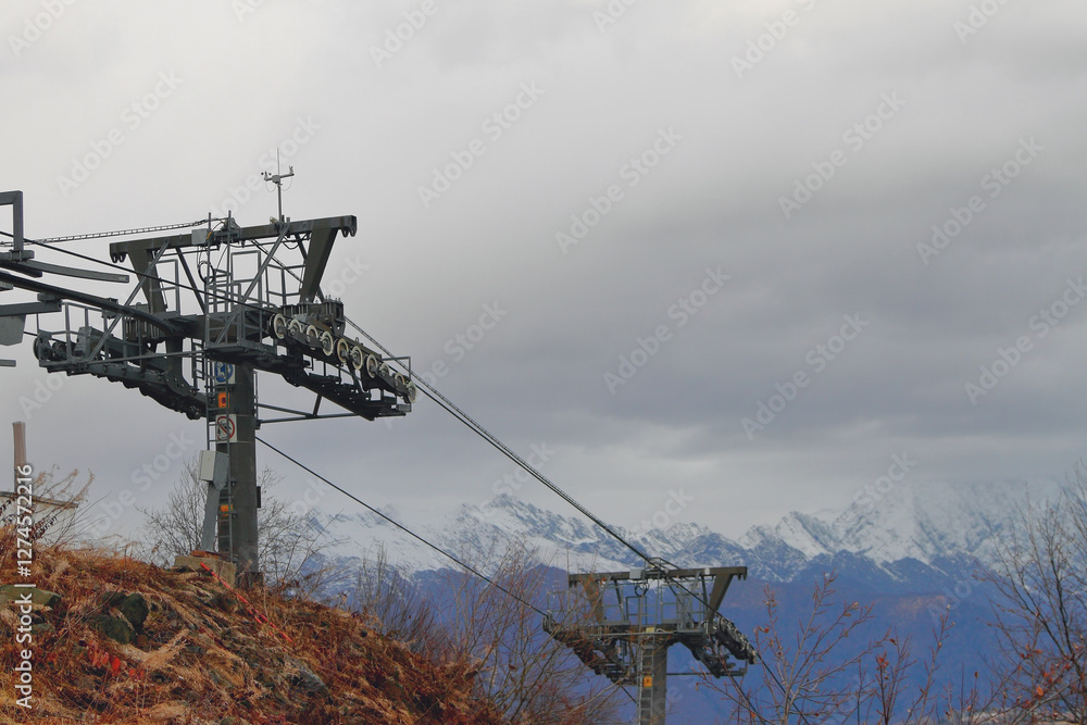 Cable car poles in mountains in late autumn. Rosa Khutor Resort, Sochi, Russia