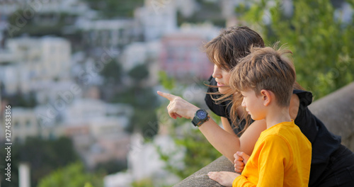 Young mother with little son admiring panorama of Positano on Amalfi