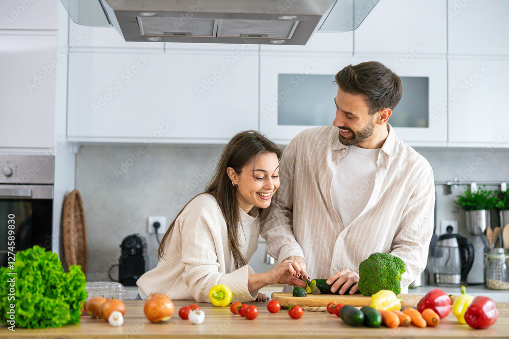 A smiling couple prepares and enjoys fresh ingredients together in a cozy, stylish kitchen environment. A smiling couple prepares and enjoys fresh ingredients together in a cozy, stylish kitchen environment.