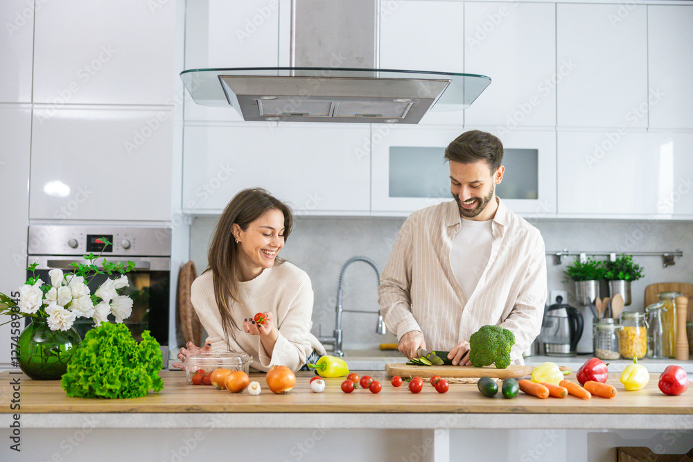 A joyful couple shares culinary moments while preparing fresh ingredients in a beautifully styled kitchen for a delicious meal. A joyful couple shares culinary moments while preparing fresh ingredients in a beautifully styled kitchen for a delicious meal.