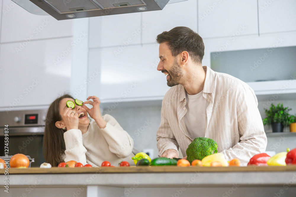In a bright kitchen, a couple shares laughter and smiles while preparing healthy meals, demonstrating love through cooking. In a bright kitchen, a couple shares laughter and smiles while preparing healthy meals, demonstrating love through cooking.
