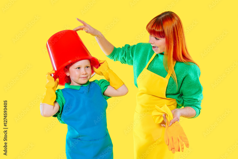 Teaching child to clean with enthusiasm with colorful props in bright yellow environment Teaching child to clean with enthusiasm with colorful props in bright yellow environment