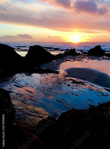 Sunset at Seal Rock National Park . North Pacific Ocean Oregon Coast. Tide pools reflecting the spectacular sunset. photo