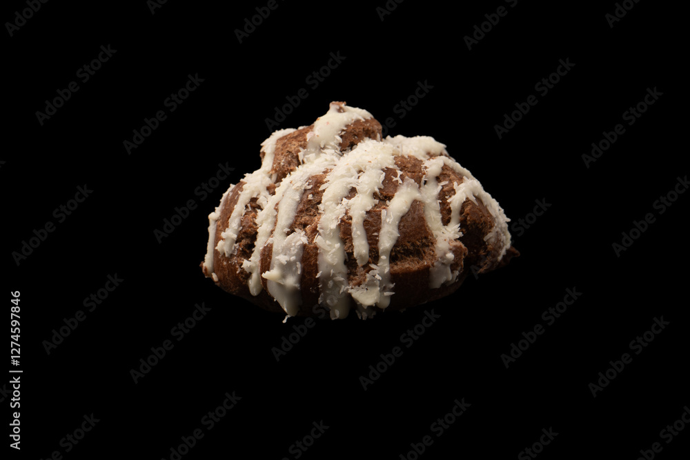 Profiteroles with coconut cream on a black background. Profiteroles with coconut cream on a black background.