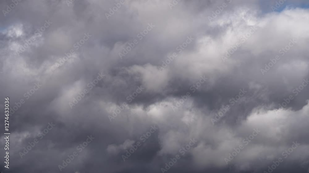 Timelapse of Thick Gray Clouds with Subtle Light and Blue Sky Timelapse of Thick Gray Clouds with Subtle Light and Blue Sky