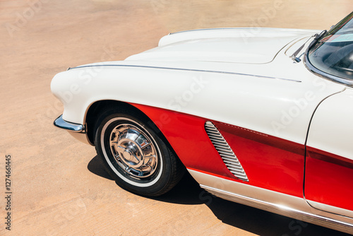 Vintage car parked on asphalt road photo