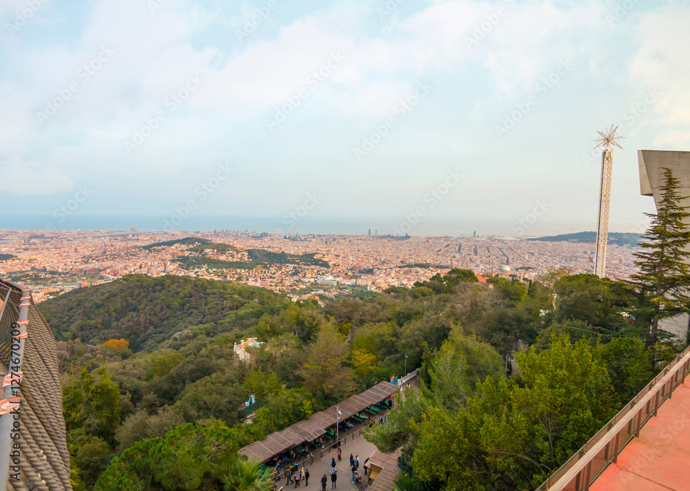 Obraz premium Tibidabo in Barcelona features breathtaking city views, the iconic Sagrat Cor church, and a historic amusement park, offering a perfect mix of culture and adventure