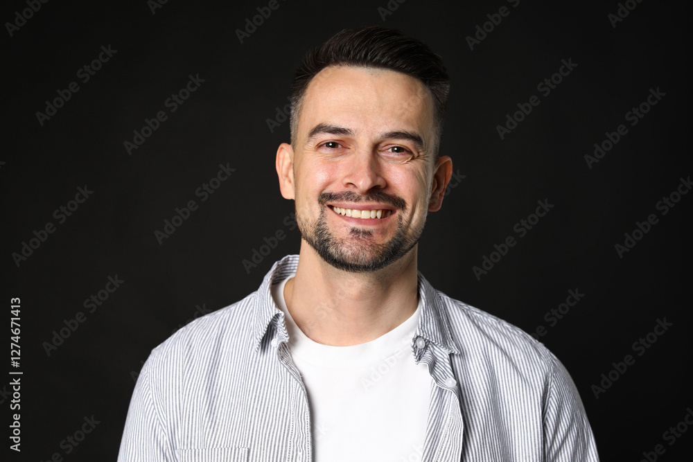 Portrait of handsome middle aged man on black background Portrait of handsome middle aged man on black background