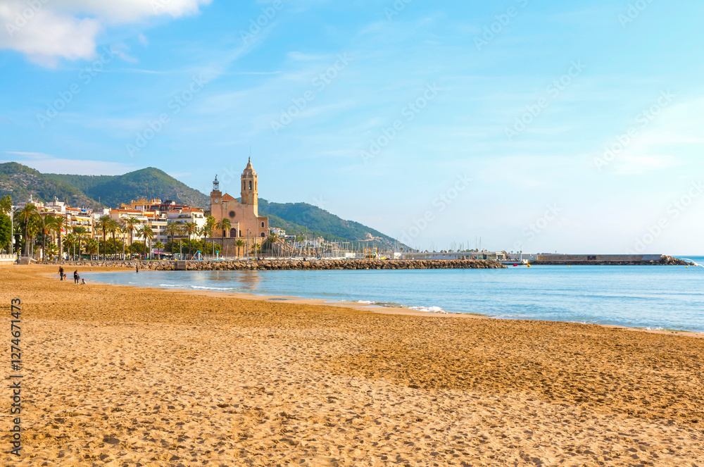 Sitges, a charming coastal town near Barcelona, features the iconic Església de Sant Bartomeu i Santa Tecla, scenic beaches, and a picturesque Mediterranean atmosphere.