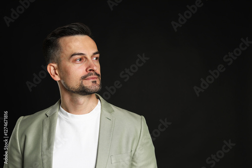 Wallpaper Mural Portrait of handsome middle aged man on black background, space for text Torontodigital.ca