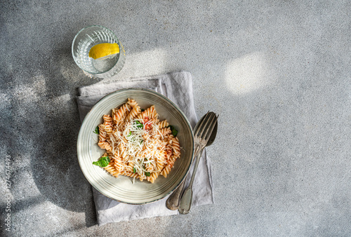 Delicious cavatappi pasta dish with spicy tomato and cheese sauce photo