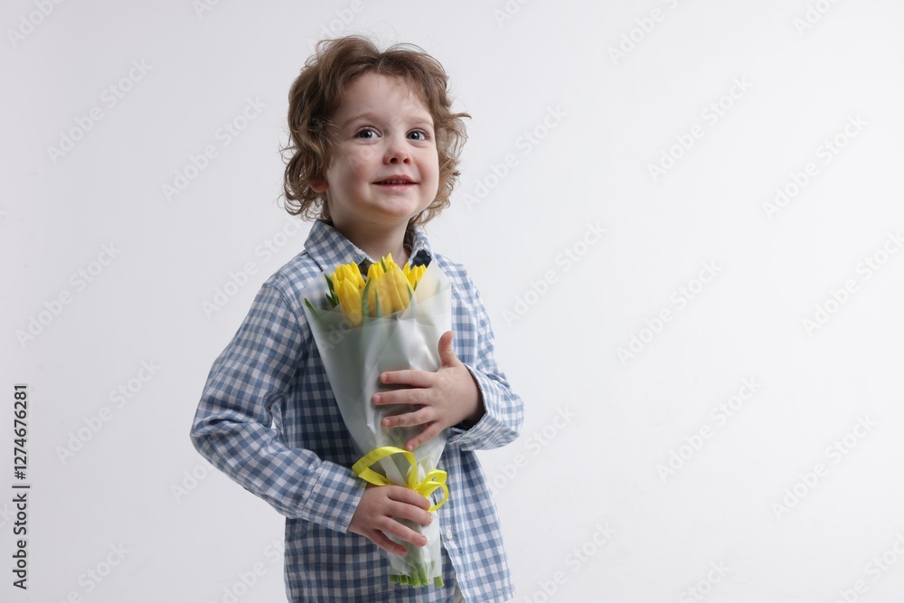 Cute little boy with bouquet of tulips on white background. Space for text Cute little boy with bouquet of tulips on white background. Space for text