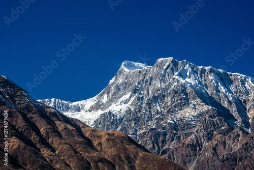 Annapurna III summit, view from the trekking route to Ngawal. Annapuran circuit, Himalaya mountains, Nepal. photo