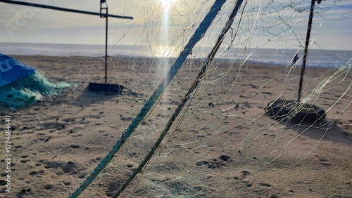Fishing equipment, boats, nets on the Atlantic coast in Portugal. Fishing trash on the ocean beach.