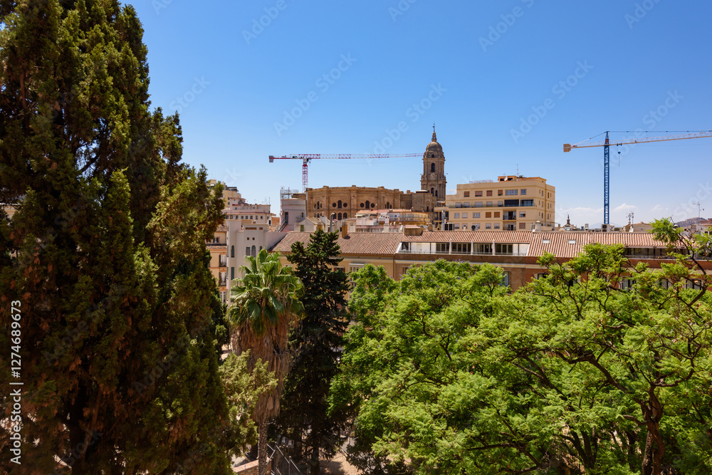 Malaga, Spain - August 06, 2024: View at the Malaga Cathedral or Santa Iglesia Catedral Basílica de la Encarnación, an iconic national landmark ,16th-century baroque facade
