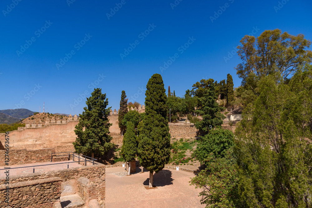 Malaga, Spain - August 06, 2024: Walls and bastion of the castle fort Gibralfaro in Malaga. Castillo de Gibralfaro.