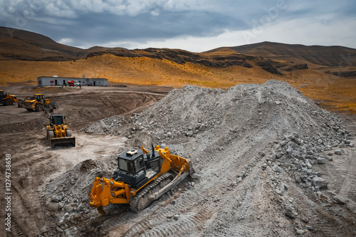 Bulldozer is doing its job at gypsum mining quarry