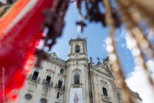 View, through colored ribbons, of the facade of the church of Nossa Senhora da Conceicao da Praia in the city of Salvador, Bahia. photo