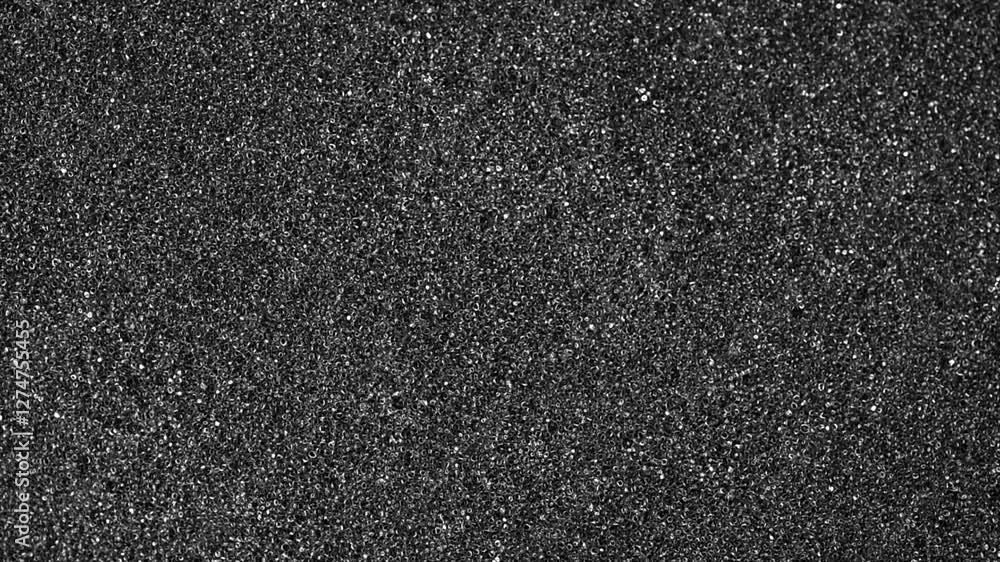 Black foam texture as background. Black foam surface, top view, flat lay. Rotating Black foam texture as background. Black foam surface, top view, flat lay. Rotating