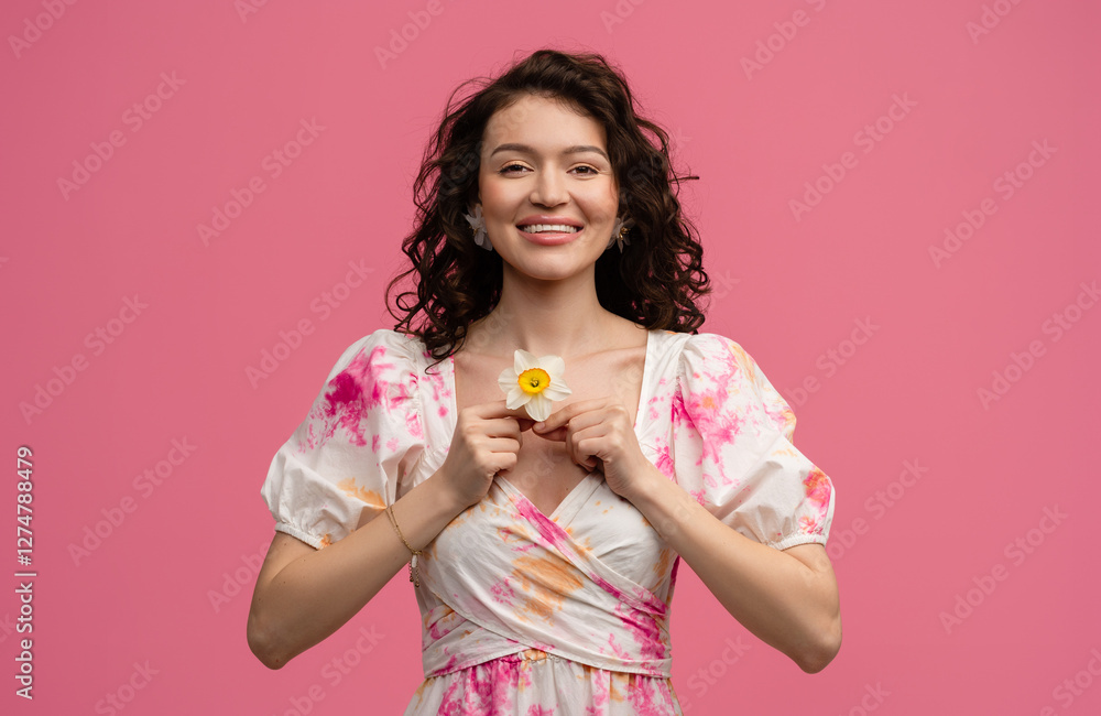 pretty young woman posing isolated on pink studio background in dress pretty young woman posing isolated on pink studio background in dress