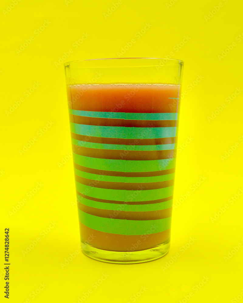 A closeup of a mixed berry smoothie in a glass. A closeup of a mixed berry smoothie in a glass.