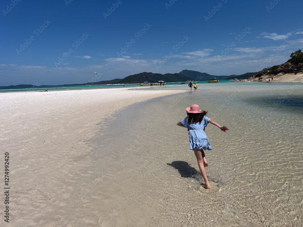 Tourists visit on Whitehaven Beach at Whitsunday Islands National Park Queensland Australia